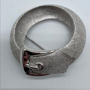 Crown Trifari Textured Silver Circle Brooch with Buckle Accent